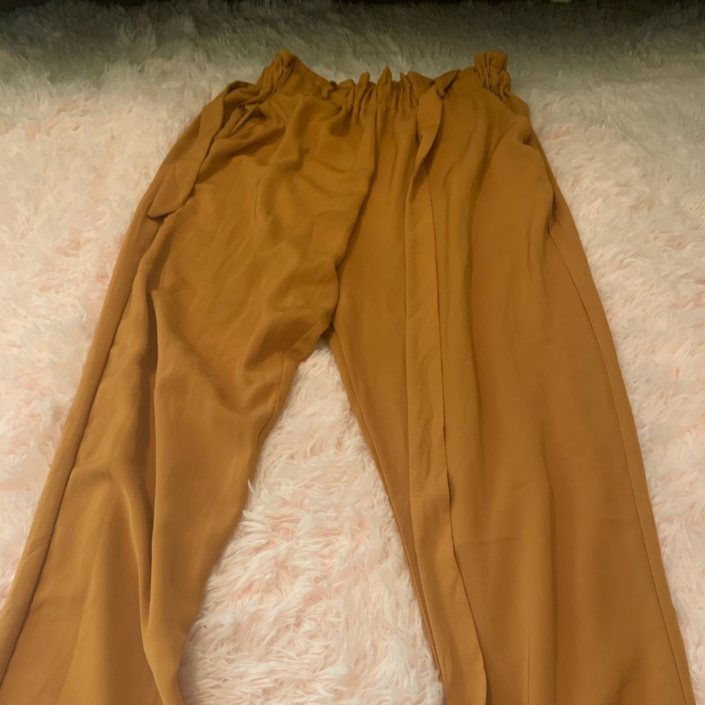 Burnt orange flowy dress pants.